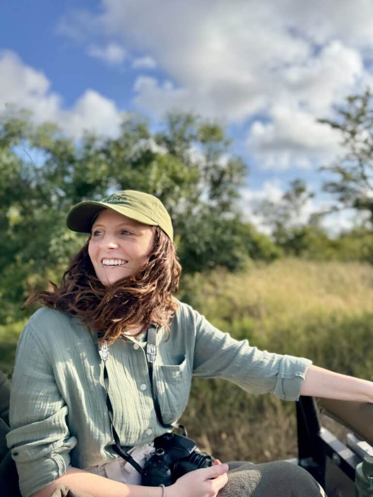 Liz from Mr and Mrs D Adventures on a safari truck in South Africa on safari.